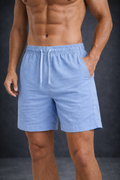 Man wearing blue shorts